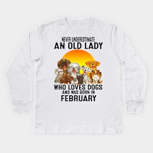 Never Underestimate An Old February Lady Who Loves Dogs Kids Long Sleeve T-Shirt